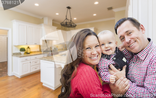 Image of Young Family Inside Beautiful Custom Kitchen