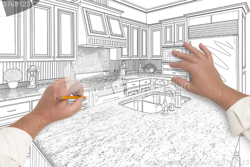 Image of Male Hands Sketching Beautiful Custom Kitchen