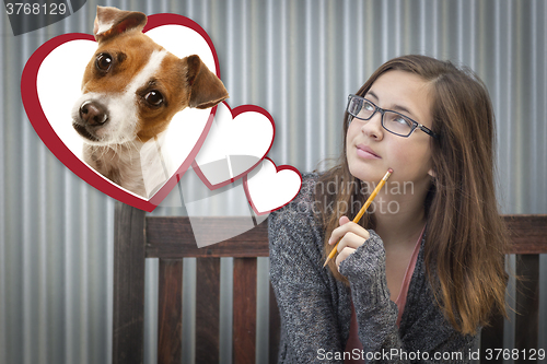 Image of Daydreaming Girl Next To Floating Hearts with Puppy Within