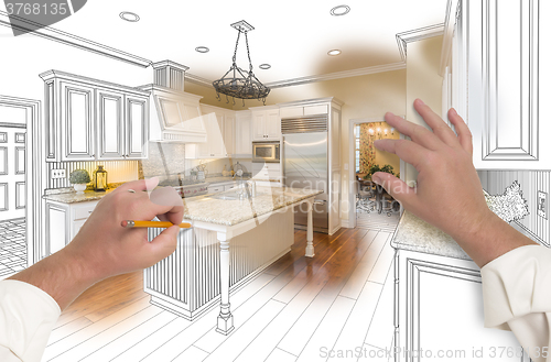 Image of Male Hands Sketching Custom Kitchen with Photo Showing Through