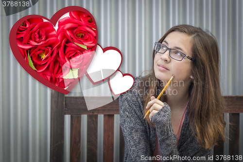 Image of Daydreaming Girl Next To Floating Hearts with Red Roses