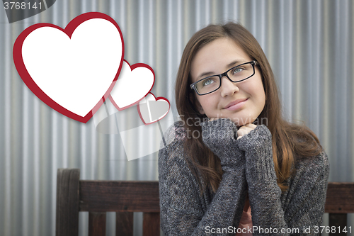 Image of Daydreaming Girl With Blank Floating Hearts - Clipping Path