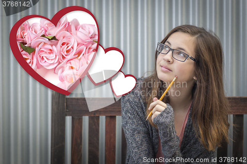Image of Daydreaming Girl Next To Floating Hearts with Pink Roses