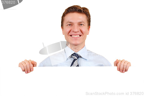 Image of Confident business man holding a white board for copy-space