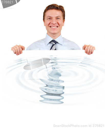 Image of Confident business holding a white board with water reflection