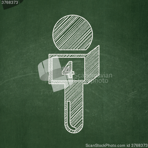 Image of News concept: Microphone on chalkboard background