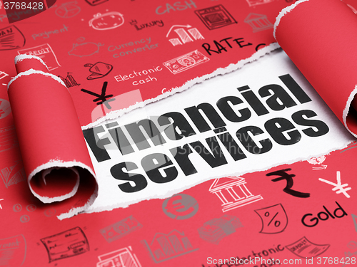 Image of Currency concept: black text Financial Services under the piece of  torn paper