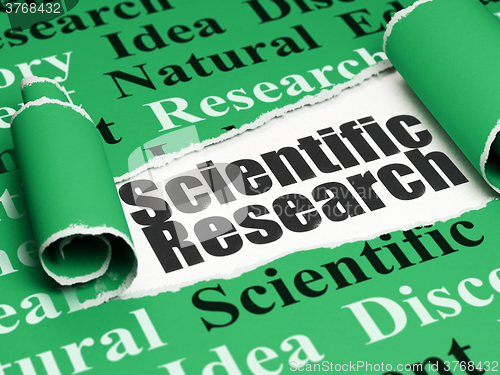 Image of Science concept: black text Scientific Research under the piece of  torn paper