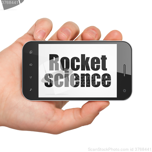 Image of Science concept: Hand Holding Smartphone with Rocket Science on display