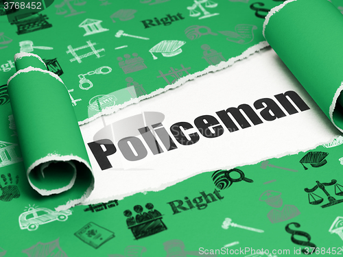 Image of Law concept: black text Policeman under the piece of  torn paper