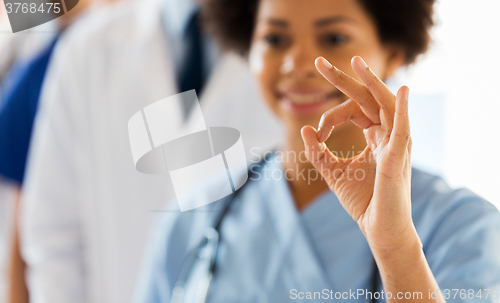 Image of close up of doctor or nurse showing ok sign