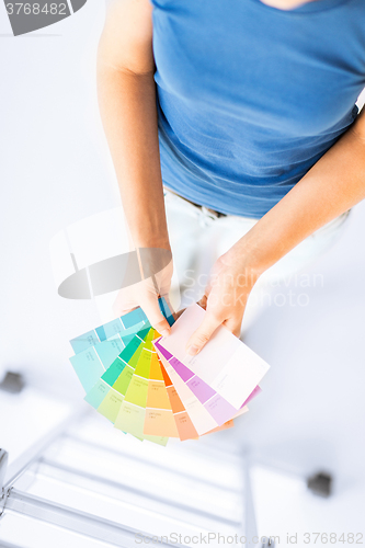 Image of woman working with color samples for selection