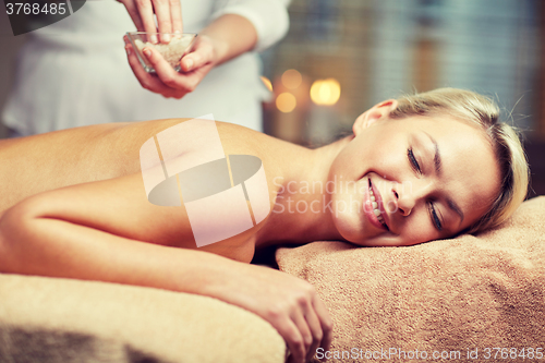 Image of close up of woman lying and having massage in spa