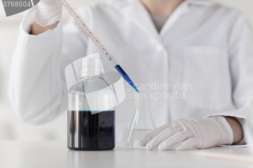 Image of close up of scientist making test in lab