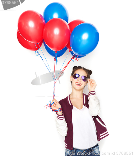 Image of happy teenage girl with helium balloons