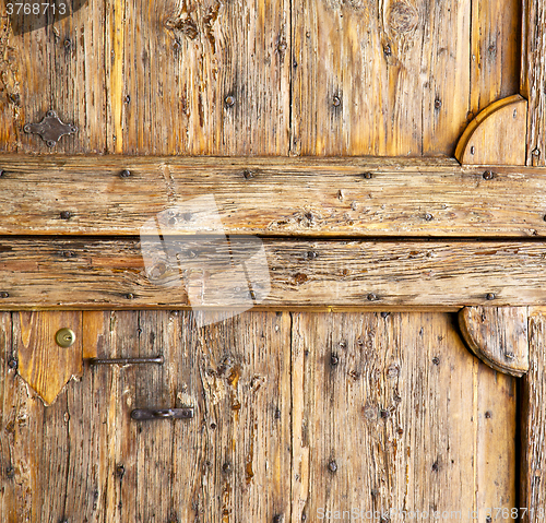 Image of  abstract   rusty brass brown  closed wood  italy   