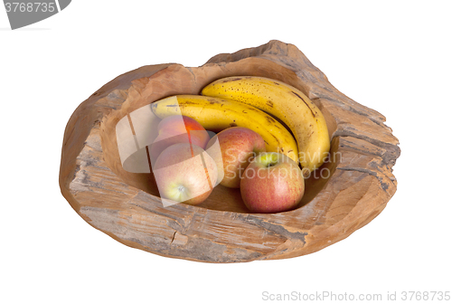 Image of Ripe fruit assortment in a wooden bowl isolated