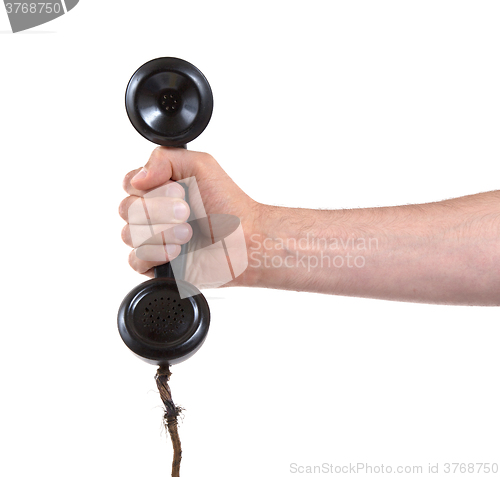Image of Male hand holding retro landline telephone