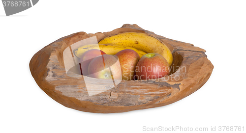 Image of Ripe fruit assortment in a wooden bowl isolated