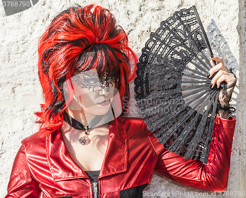 Image of Disguised Woman with a Fan - Venice Carnival 2012