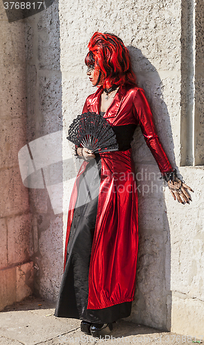 Image of Disguised Woman with a Fan - Venice Carnival 2012