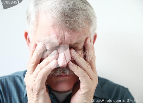 Image of Senior suffering from sinus pressure
