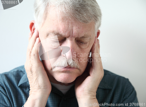 Image of Senior with pain in front of ears	