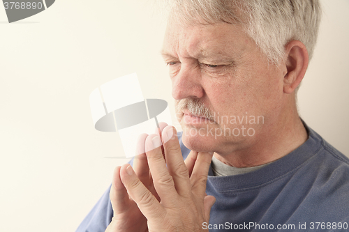 Image of Older man thinking