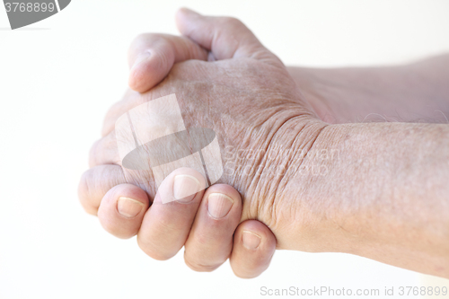 Image of Man with hands clasped