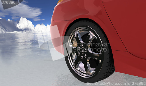 Image of Red sport car on thin ice , rear wheel