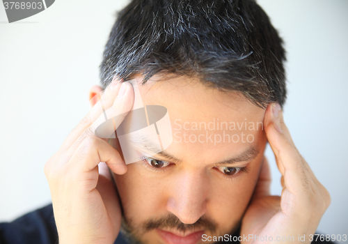 Image of Temple headache pain in young man