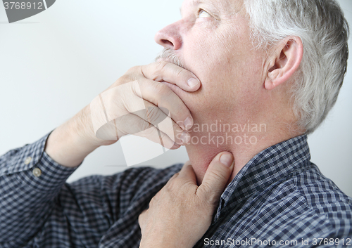 Image of Man with throat or neck problems