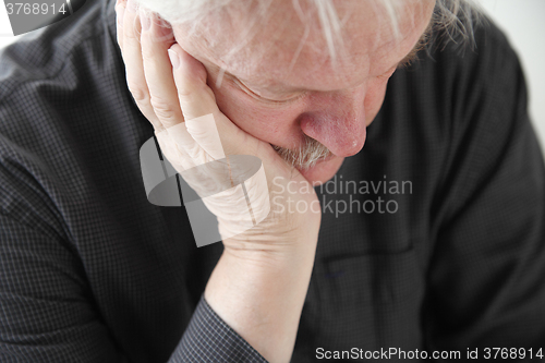 Image of Unhappy older man
