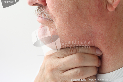 Image of Older man with throat pain	