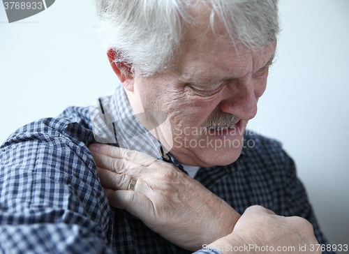 Image of Man suffering from shoulder pains