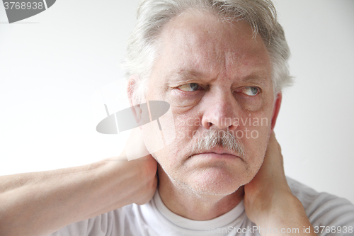 Image of Mature man with neck pain