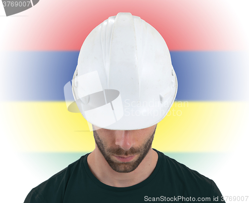 Image of Engineer with flag on background - Mauritania
