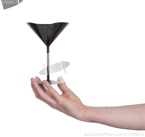 Image of Black plastic coctail glass in hand