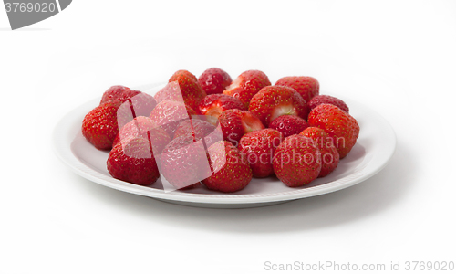 Image of Heap of prepared strawberry on plate, isolated