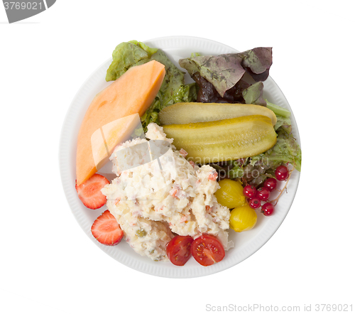 Image of Snack time - View of Russian salad on a white plate