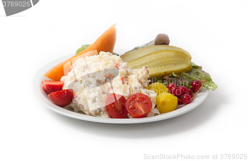 Image of Snack time - View of Russian salad on a white plate