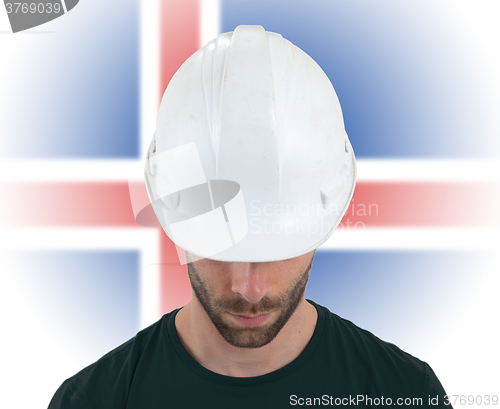 Image of Engineer with flag on background - Iceland