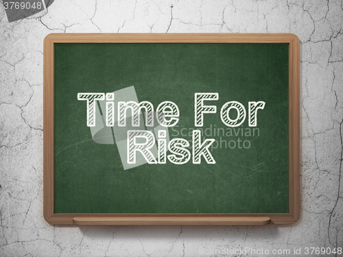Image of Time concept: Time For Risk on chalkboard background