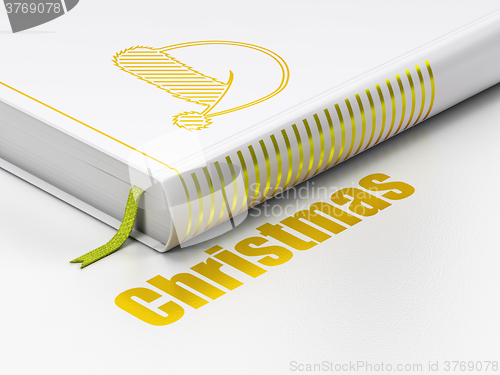 Image of Holiday concept: book Christmas Hat, Christmas on white background