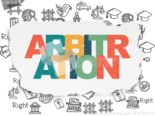 Image of Law concept: Arbitration on Torn Paper background