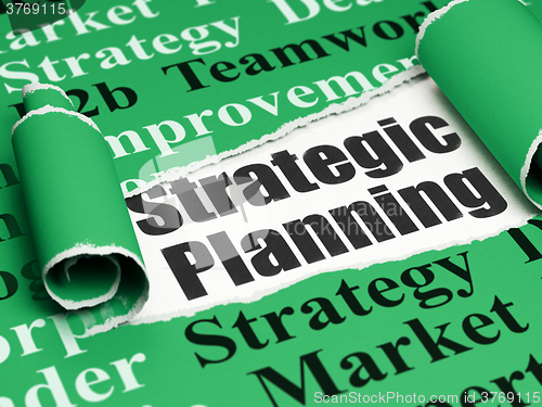 Image of Finance concept: black text Strategic Planning under the piece of  torn paper
