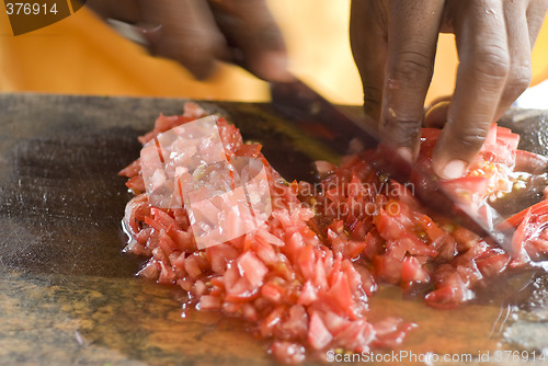 Image of man preparing tomatoes for ceviche