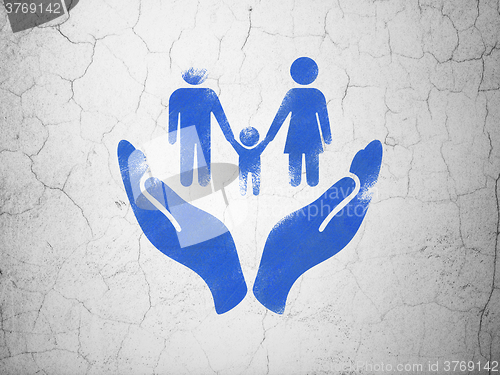 Image of Insurance concept: Family And Palm on wall background