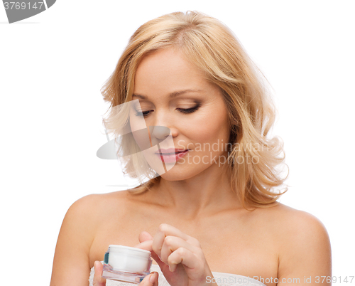 Image of middle aged woman with cream jar