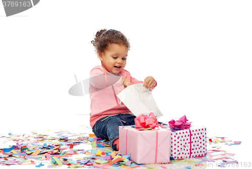 Image of happy little baby girl with birthday presents